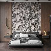 Bedroom with stone wall
