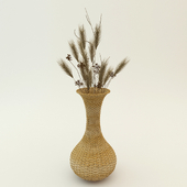 Wicker vase with dried flowers