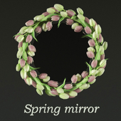 The mirror in the frame of tulips
