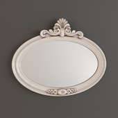 Oval mirror in carved frame