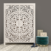 Carved Lombok Armoire with Velvet Carousel Ottoman pouf by Anthropologie