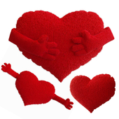 A set of knitted pillows in the shape of a heart