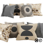 Pillows with gold, black block print and braid