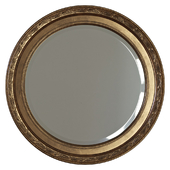 Round mirror in a frame