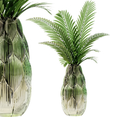 Exotic glass vase with Howea plants