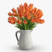 Orange tulips in jug