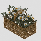 Basket with a bouquet of daisies