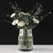 Bouquet with eucalyptus and ranunculus in a vase