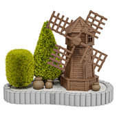 Garden decorative wooden mill with thujas