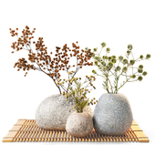 Dried flowers in stone vases