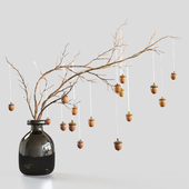 Branch with decorative acorns in a jar