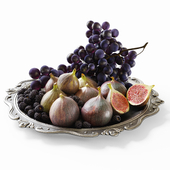 Grapes, figs and blackberries in a classic plate