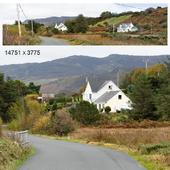 Autumn panorama. View of a private house, road and forest with mountains.