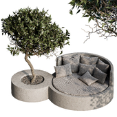 Round garden sofa on a concrete base with a decorative tree