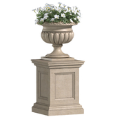 White Petunia flower in a classic flowerpot on Pedestal for decorating the facade.Petunia Plant Flowerpot