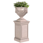 A flowers in a classic vase for decorating the facade.Plant Flowerpot