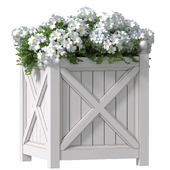 A flower bed of white flowers in a garden planter.Flower Garden Planter Box Patio