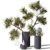 Two New Year's bouquets of pine branches in gray ribbed vases