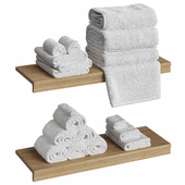 Towels on a wooden shelf