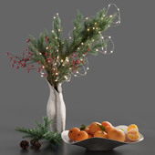Christmas fir branch with garland and tangerines