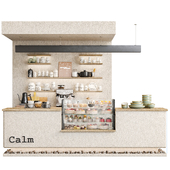 Designer coffee shop with stones and a display case with desserts