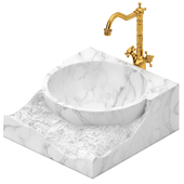 white marble sink with brass faucet