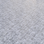 Texture of snow-covered paving stones