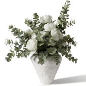 Bouquet with eucalyptus and peonies in a white clay vase