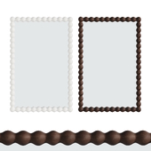 ZARA HOME Rectangular wall mirror with wooden frame.